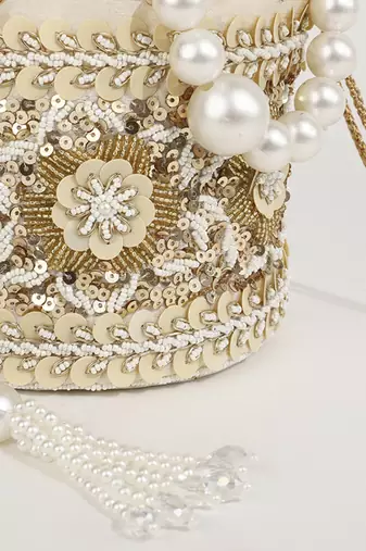 Gold silk potli bag with pearl handle