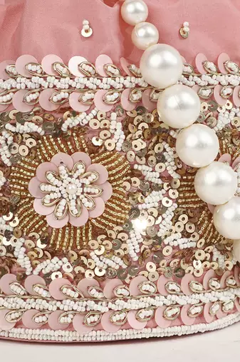 Pink silk potli bag with pearl handle