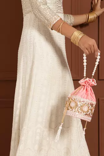 Pink silk potli bag with pearl handle