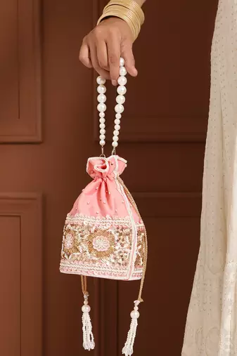 Pink silk potli bag with pearl handle