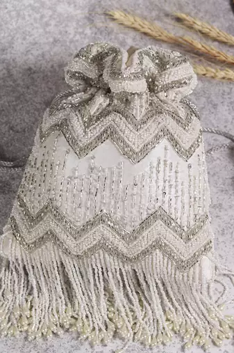 Suede white potli bag with detachable chain