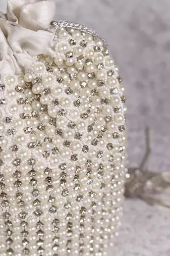 White suede potli bag with with detachable chain