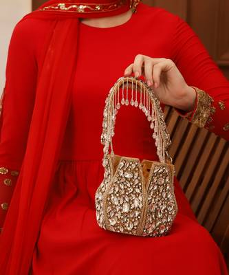 Suede gold potli bag with handle 1