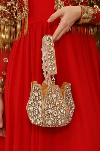 Suede gold potli bag with handle