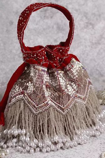 Red suede potli bag with handle