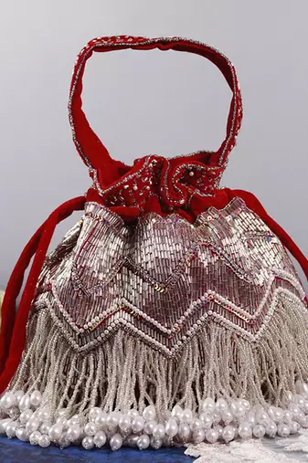 Red suede potli bag with handle
