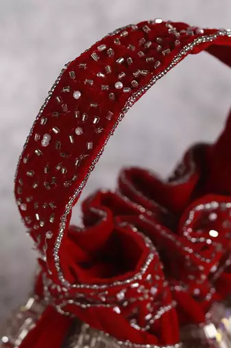 Red suede potli bag with handle