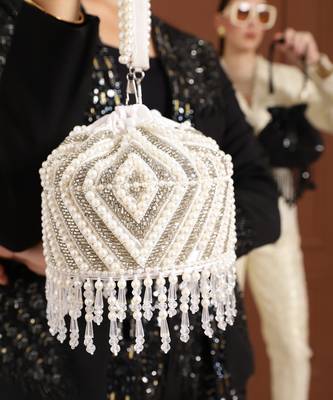 White suede embroidered mini potli with glass bead hangings 1
