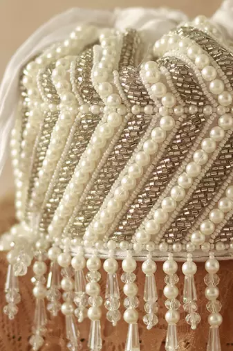 White suede embroidered mini potli with glass bead hangings