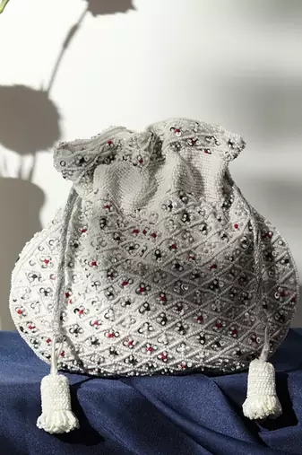 Suede white potli bag with handle