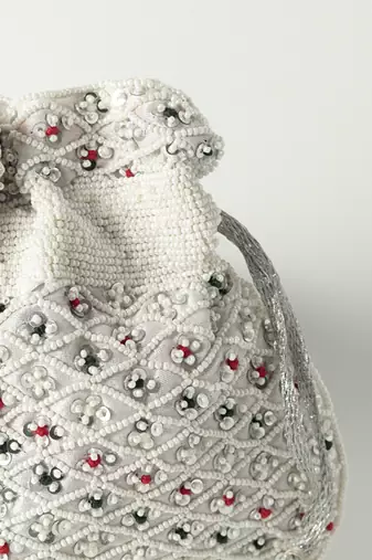 Suede white potli bag with handle