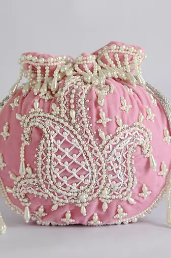 Pink suede hand embroidered potli with pearl handle