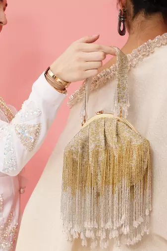 Gold suede clutch with detachable chain