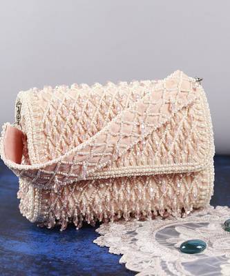 Pink suede clutch bag with a detachable pearl handle 1