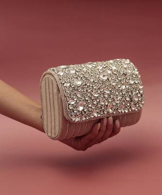 Beige suede embellished clutch bag 1