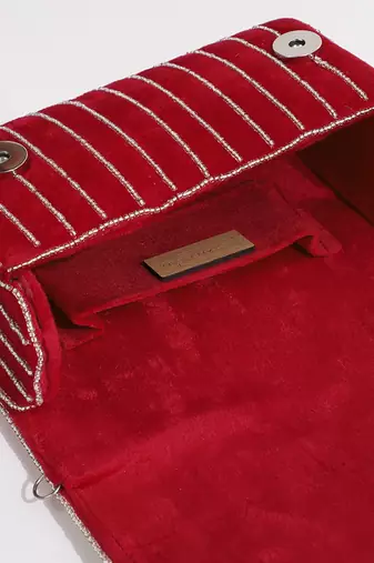 Red suede embellished clutch bag
