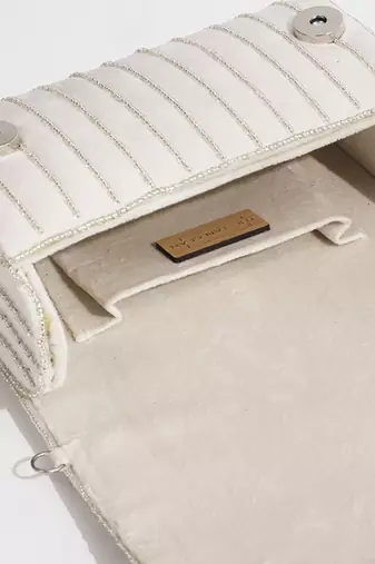White suede embellished clutch bag