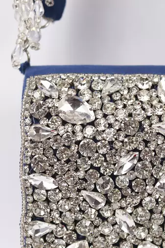 Blue suede mini bag with embroidered handle