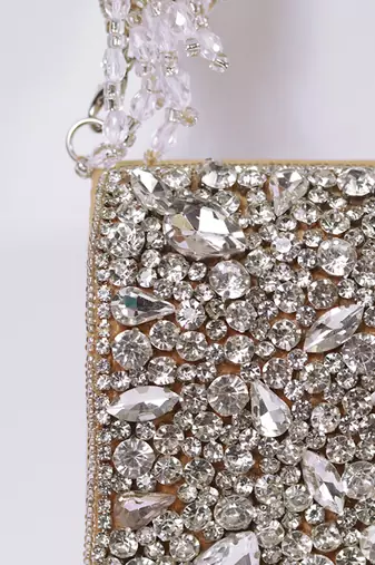 Gold suede mini bag with embroidered handle