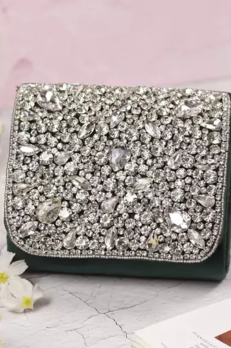 Green suede mini bag with embroidered handle