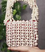 Red suede mini bag with embroidered handle