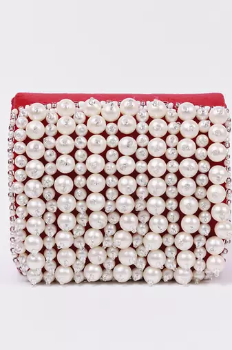 Red suede mini bag with embroidered handle