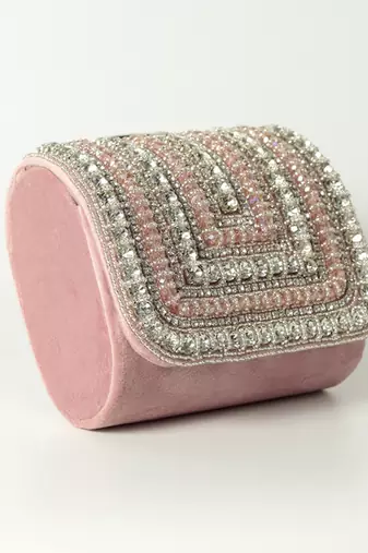 Pink suede mini bag with embroidered handle
