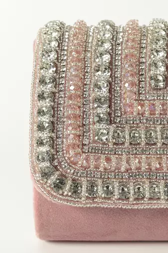 Pink suede mini bag with embroidered handle