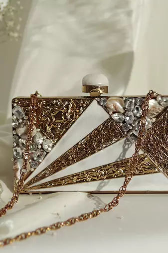 Gold bead embellished mother of pearl clutch