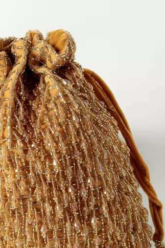 Gold suede golden potli bag with handle