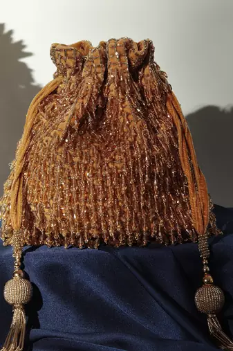 Gold suede golden potli bag with handle
