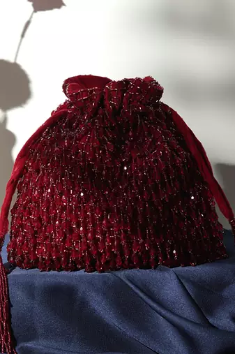 Red suede red potli bag with handle