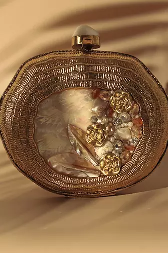 Embellished gold mother of pearl clutch