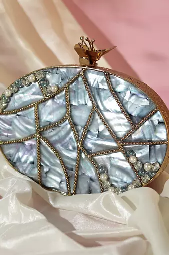 Mother of pearl gold embellished clutch