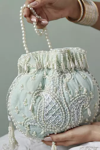 Blue suede hand embroidered potli with pearl handle