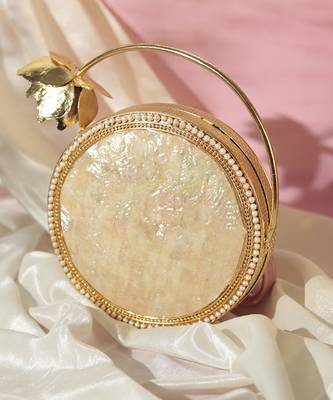 Gold embellished mother of pearl clutch 1