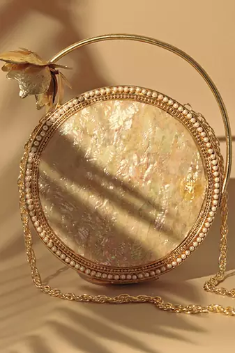 Gold embellished mother of pearl clutch