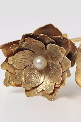 Gold embellished mother of pearl clutch
