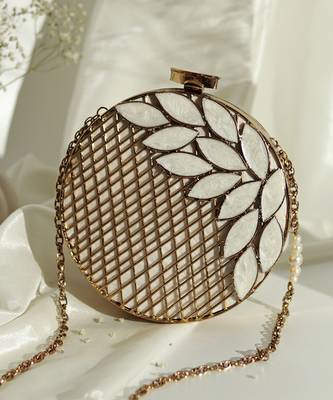 Gold pearl clutch with intricate brass work 1