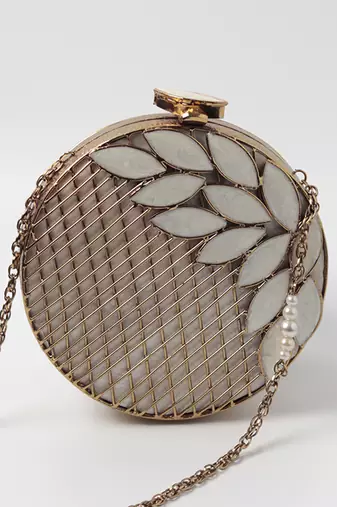 Gold pearl clutch with intricate brass work