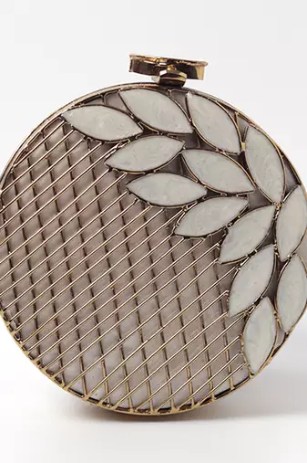 Gold pearl clutch with intricate brass work