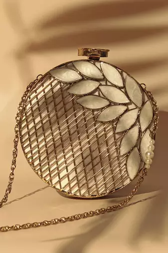 Gold pearl clutch with intricate brass work