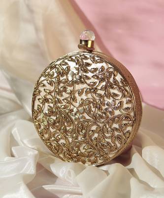 Gold intricate brass work pearl clutch 1