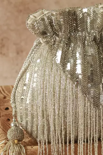 Silver silk tassles potli with handle