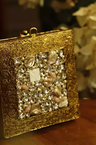 Red rose gold embellished clutch