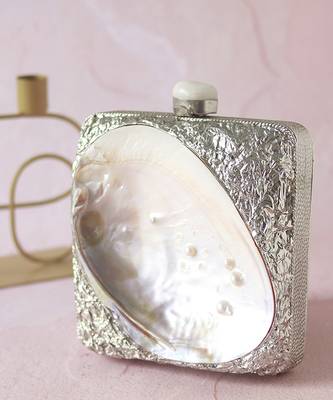 Silver clutch handcrafted with intricate detailing 1