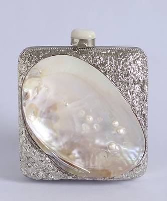Silver clutch handcrafted with intricate detailing 2