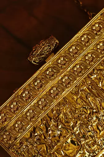 Gold beaded golden embellished brass clutch
