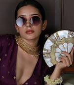 Embellished golden brass clutch