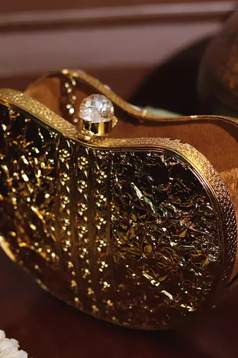 Gold beaded embellished brass clutch golden
